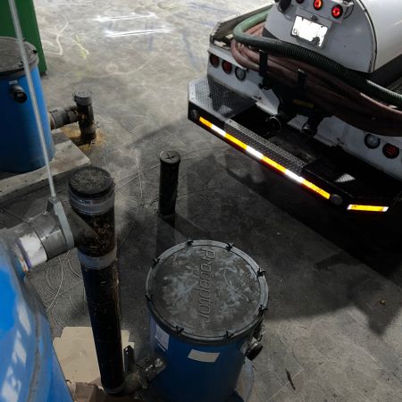 cleaning a grease trap in Lakewood City, California